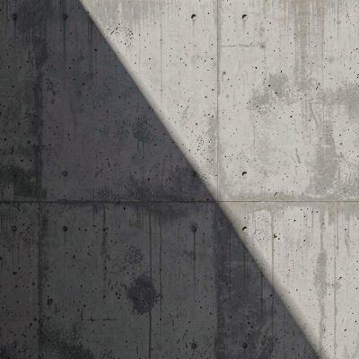 a concrete wall with a diagonal shadow