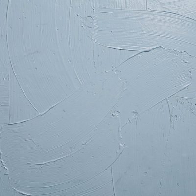 a chalky pastel blue painted surface