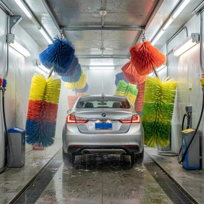 a car wash tunnel with brushes turning