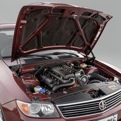 a bonnet open showing a clean engine