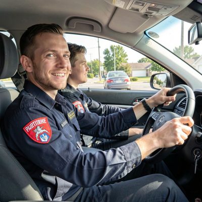a driving instructor and learner in a car