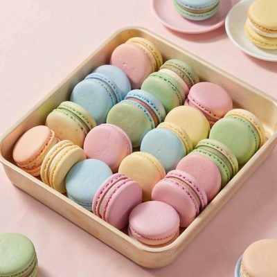 a tray of macarons in pastel colours