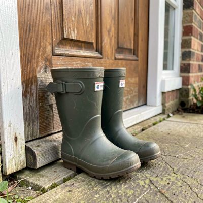 a child's welly boots by a back door