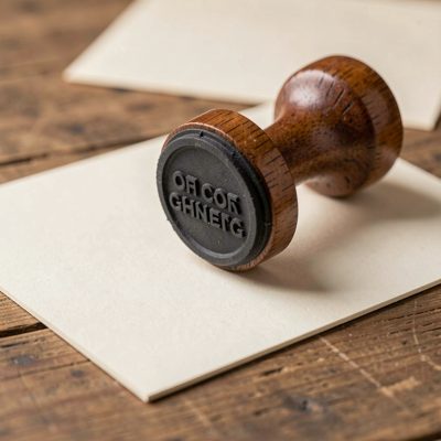 a rubber stamp being pressed onto card