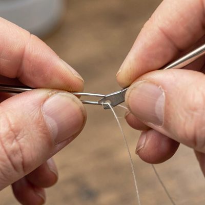 a needle threader being used