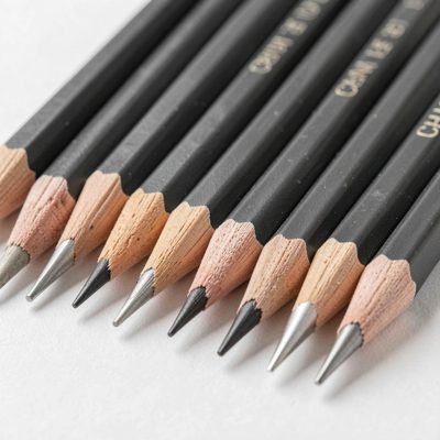 a set of graphite pencils sharpened in a row