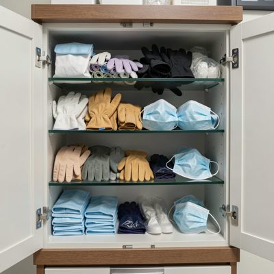 a cabinet of gloves and masks in a surgery