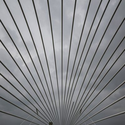 bridge cables in a fan pattern against a grey sky