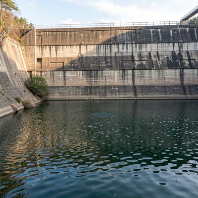 a reservoir dam wall with water below