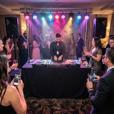 a dj booth with lights at a private party