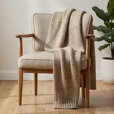 a knitted scarf draped over a chair