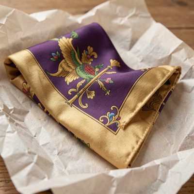 a folded silk scarf on tissue paper