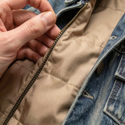 a jacket lining being stitched in