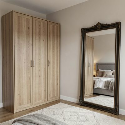 a guest bedroom with a wardrobe and a mirror