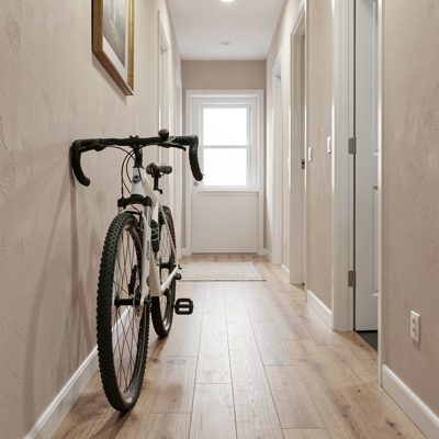 a hallway with a bicycle propped against a wall