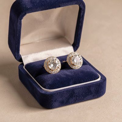 a pair of earrings in an open box
