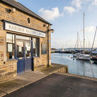 a harbour master's office with a view of the quay