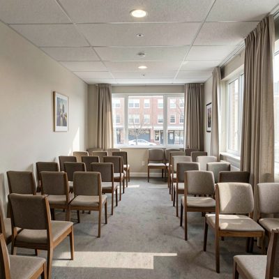 a waiting room with rows of chairs