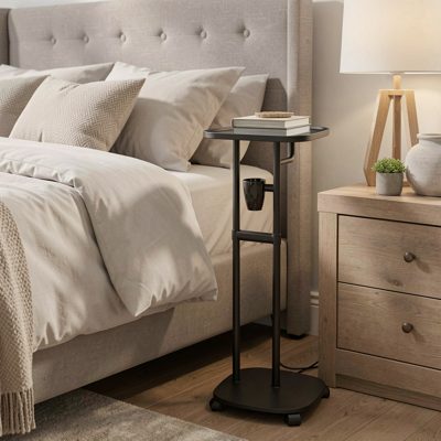 a drip stand beside a bed