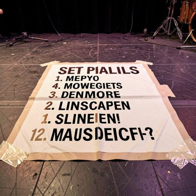 a set list taped to the floor of a stage