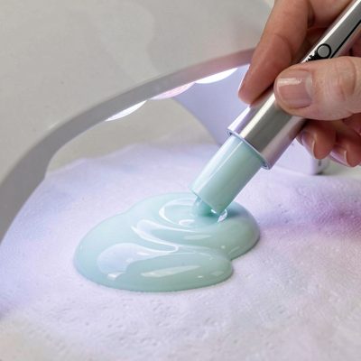 gel polish being cured under a uv lamp
