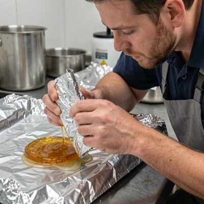 a technician removing gel with foil wraps