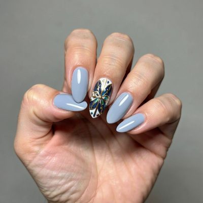 a hand posed to show off painted nails