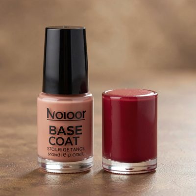 a bottle of base coat standing beside a colour