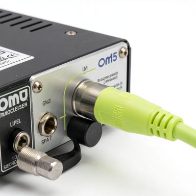 a lime green om5 fibre patch lead plugged into a transceiver