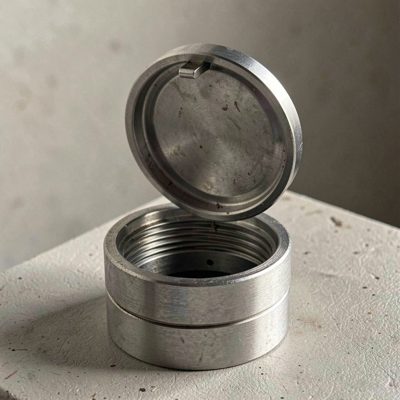 a dust cap being lifted from a fibre port
