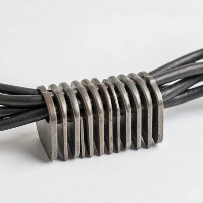 a cable comb holding a row of cables in alignment