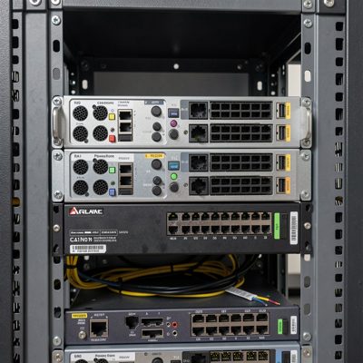 a router with redundant power supplies mounted in a rack