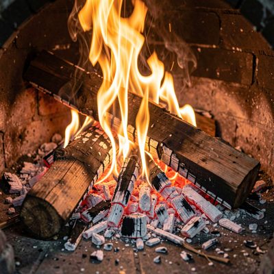 a wood fire burning down to embers