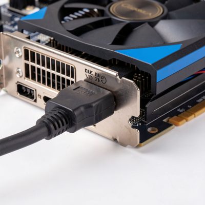 a graphics card power connector being plugged in, no logos, no text, no branding