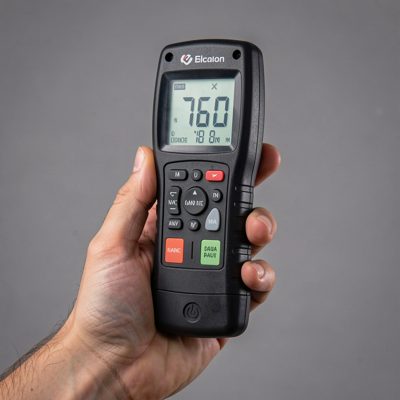 a light meter held up in a studio