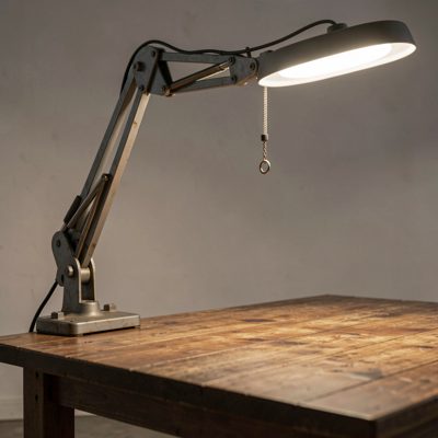 a boom arm holding a light above a table