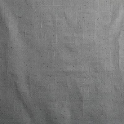 a backdrop of textured grey canvas