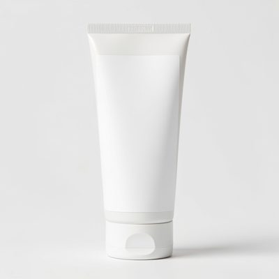 a partly squeezed cream tube with a blank white label