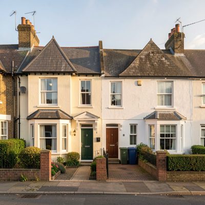 a semi detached pair of houses in morning light