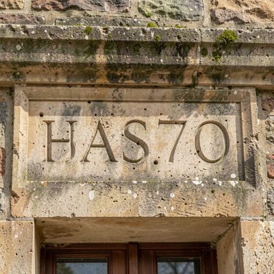 a house number carved into a stone lintel