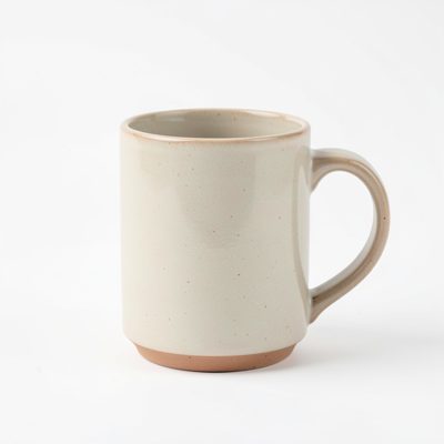 a minimal product photograph of a ceramic mug on white