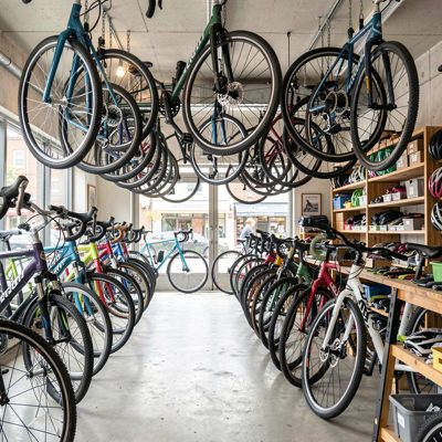 a bicycle shop with frames hanging from the ceiling