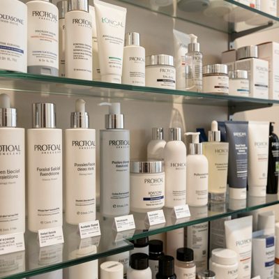 a shelf of professional facial products