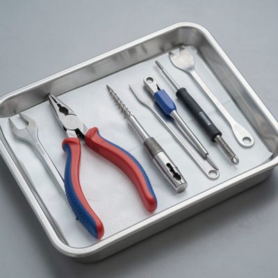 a set of extraction tools on a sterile tray