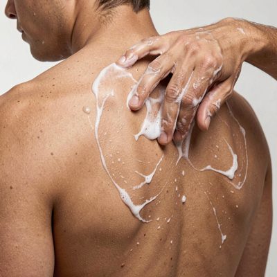a body scrub being applied to a back