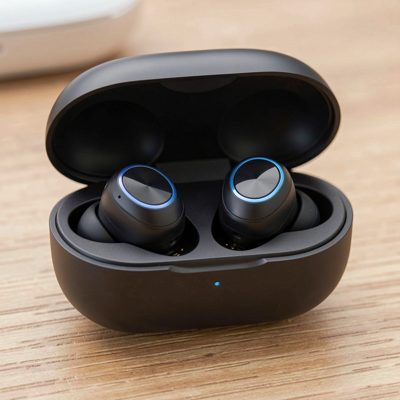 a pair of wireless earbuds in an open charging case