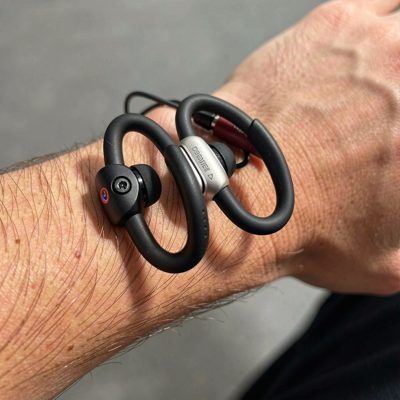 a pair of bone conduction headphones on a wrist rest