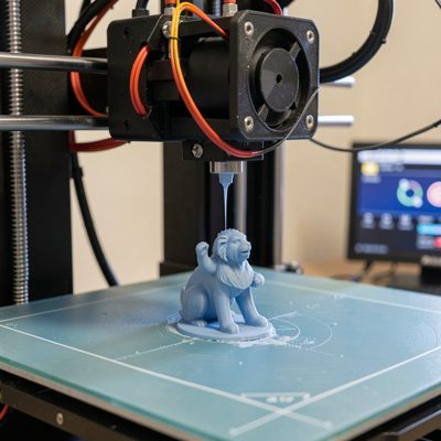 a 3d printer part way through printing a small object
