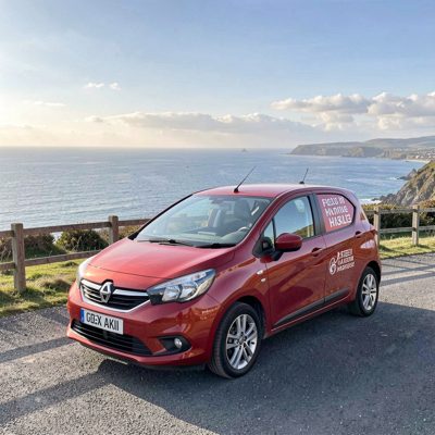 a hire car parked at a scenic viewpoint
