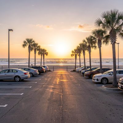 a beach parking lot at first light